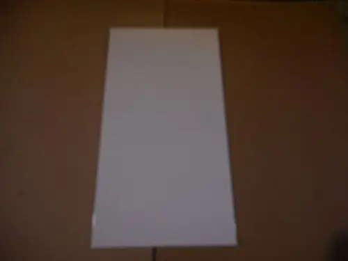 Weiße Abdeckhaube vor einem schlichten Hintergrund, die möglicherweise für ein Remeha-Produkt geeignet ist. Die Oberfläche ist glatt und ohne erkennbare Details.
